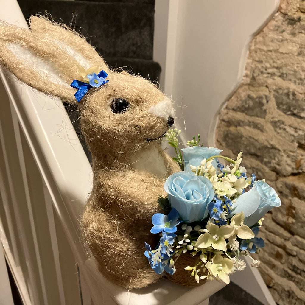 Child’s graveside memorial rabbit planter with flower arrangement