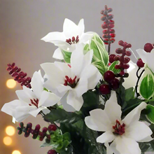 Artificial Christmas bouquet of red berries and white poinsettia