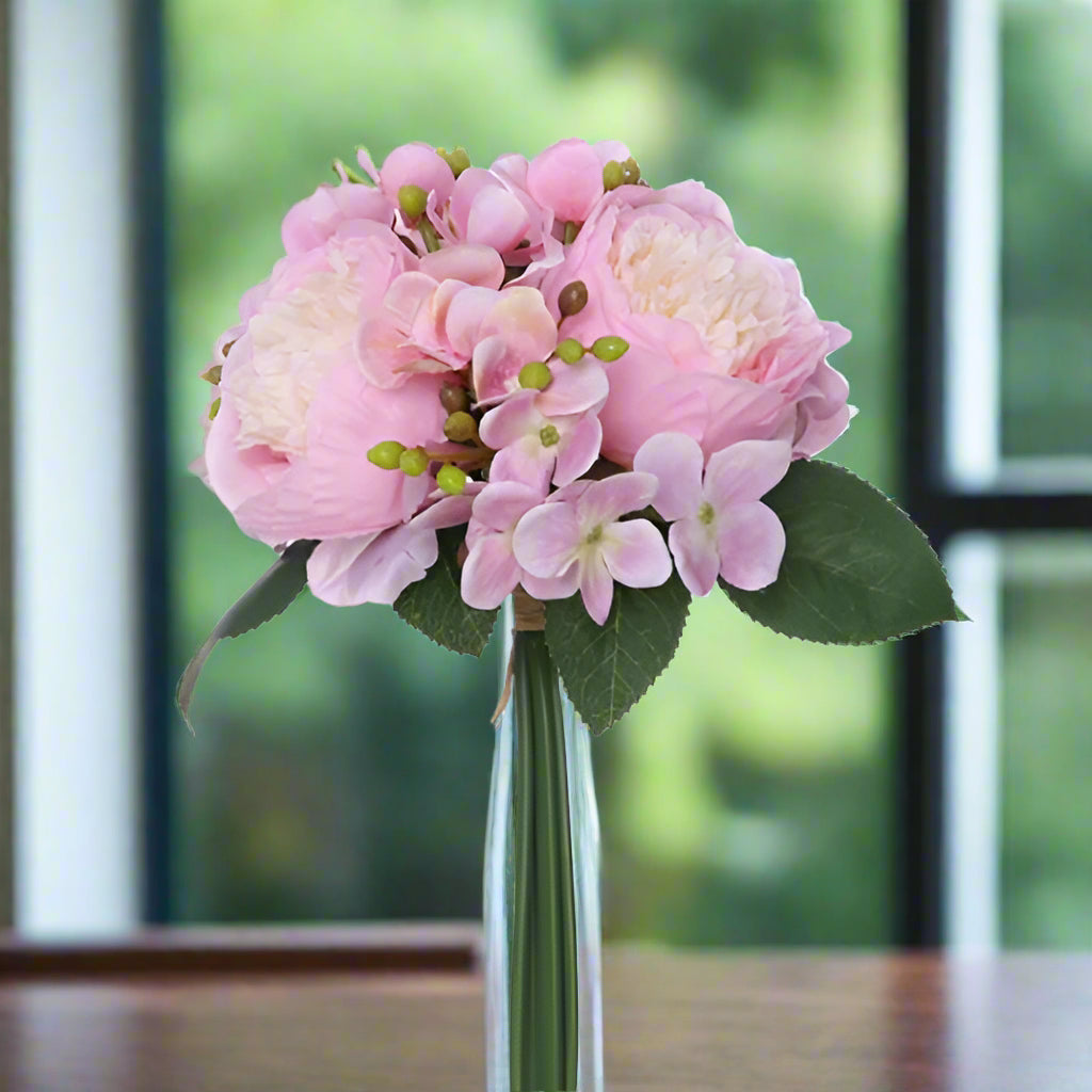 A bunch of faux silk pink hydrangea and peonies