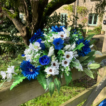 A teardrop wedding bouquet collection of gerbera and daisies