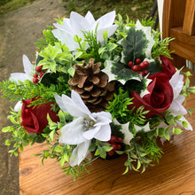 a christmas grave side memorial pot with flower arrangement