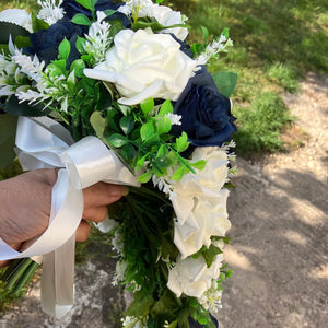 A teardrop bouquet of navy and ivory artificial roses flowers