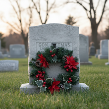 An artificial pine christmas wreath with holly and poinsettia