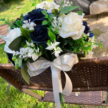 A teardrop bouquet of navy and ivory artificial roses flowers