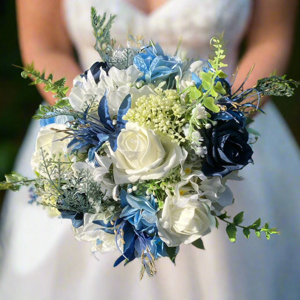 A bridesmaids bouquet of blue & white and ivory silk flowers