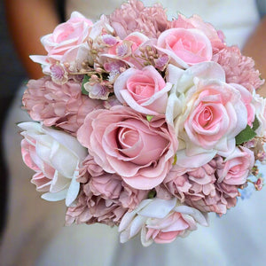 wedding bouquet of artificial pink roses and peonies