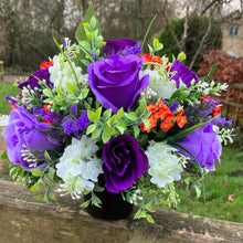 Artificial graveside flowers arrangement in black pot