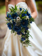 A teardrop wedding bouquet collection of gerbera and daisies