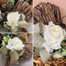 A heart wreath with faux roses and foliage