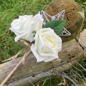 A bridesmaids star wand with ivory roses & hessian handle