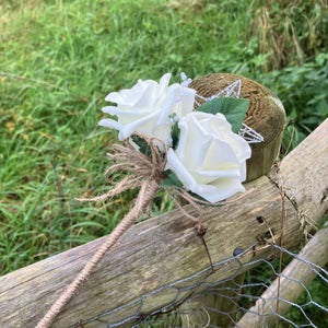 A bridesmaids star wand with ivory roses & hessian handle