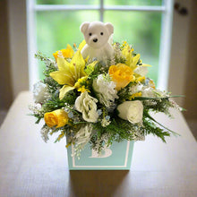 flower arrangment for new baby in blue cube