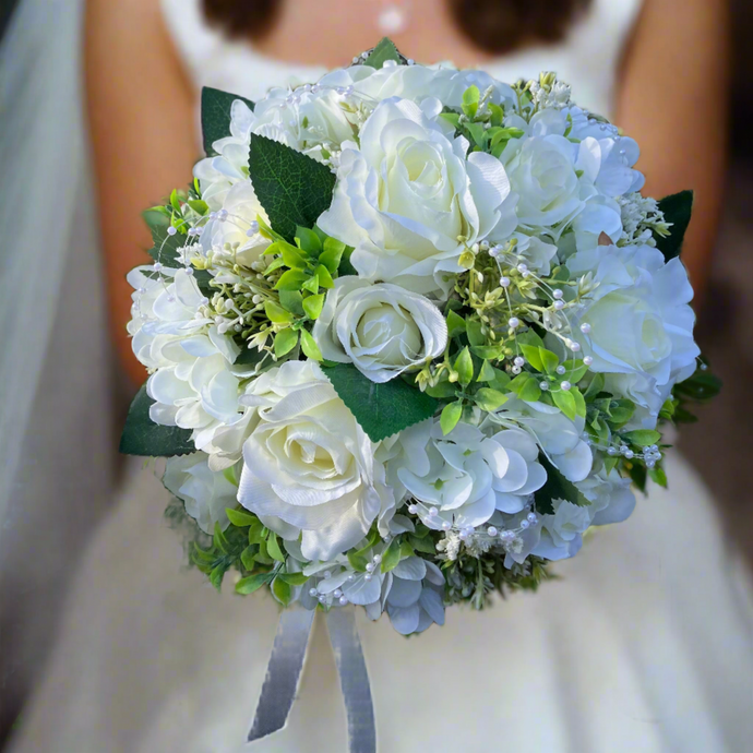 A wedding bouquet collection of artificial silk roses, hydrangea & gyp