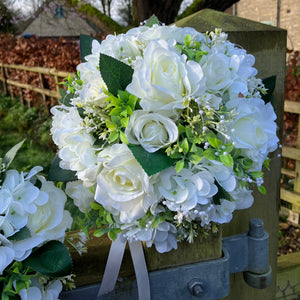 A wedding bouquet collection of artificial silk roses, hydrangea & gyp