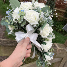 A wedding bouquet collection of foam roses and forget-me-not's
