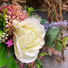 A heart wreath with silk of roses and foliage