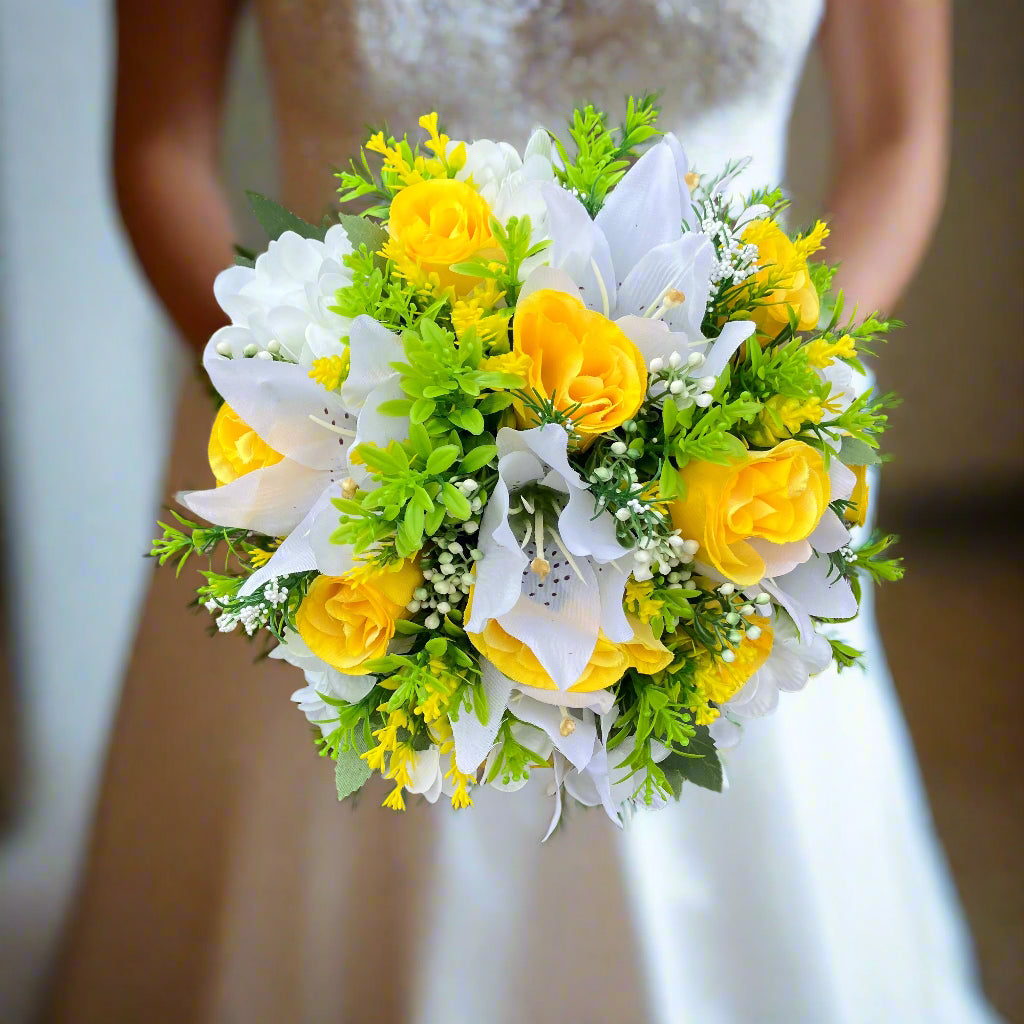 A wedding bouquet collection of yellow and ivory silk flowers