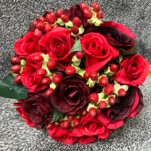 a wedding bouquet of red and burgundy silk roses & hypericum