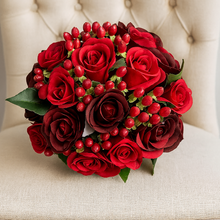 a wedding bouquet of red and burgundy silk roses & hypericum