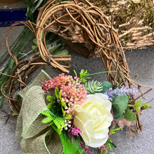 A heart wreath with silk of roses and foliage