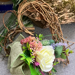 A heart wreath with silk of roses and foliage