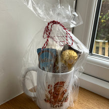 a christmas ceramic mug, hot chocolate marsh mallows, chocolate & sweets