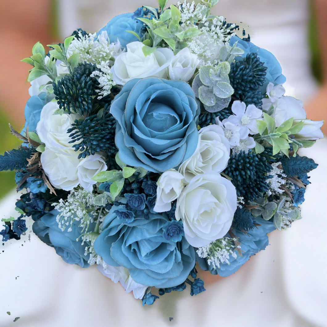 A wedding bouquet collection of ivory and teal flowers and foliage