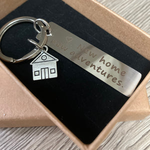 Stainless steel keyring with ‘new home, new adventures’ token