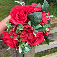 A wedding bouquet collection of artificial red flowers