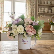 Flower arrangement in ceramic mug