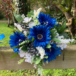 A teardrop wedding bouquet collection of gerbera and daisies