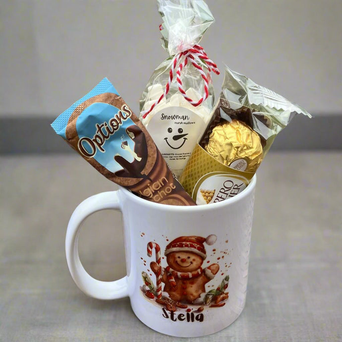 a christmas ceramic mug, hot chocolate marsh mallows, chocolate & sweets