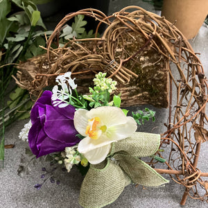 A heart wreath with flower arrangement