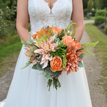 A handtied wedding bouquet featuring artificial flowers