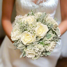 ivory rose wedding bouquet with soft grey foliage