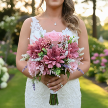 A brides posy featuring artificial pink silk gerbera and roses