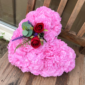 a based memorial heart of roses and carnations in shades of pink & red