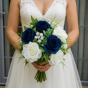 A brides bouquet of deep navy and ivory faux silk artificial flowers