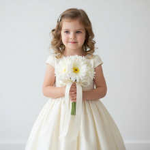 A bridesmaids posy featuring ivory silk gerbera flowers