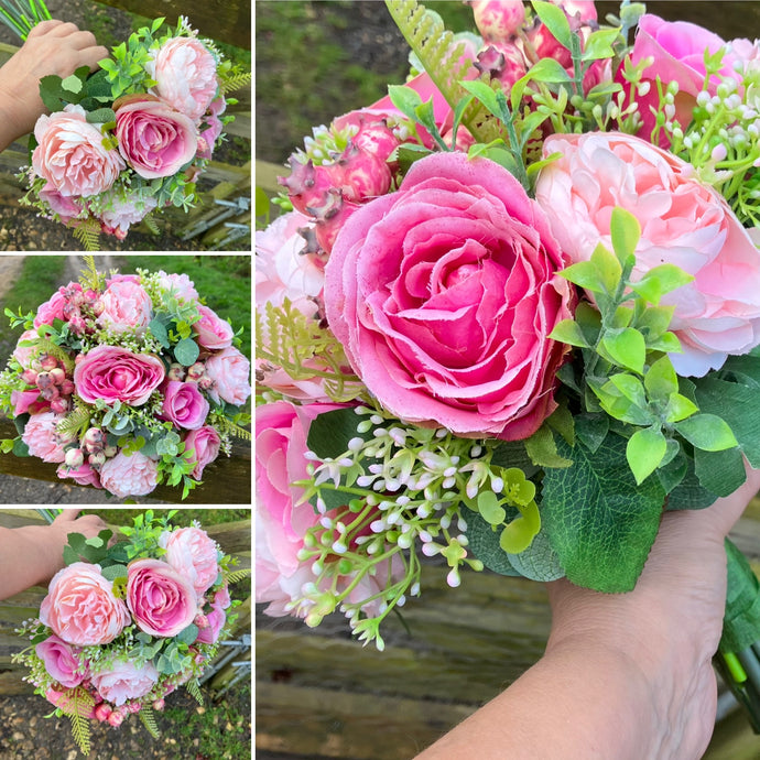 A wedding bouquet featuring pink roses and ranaculus
