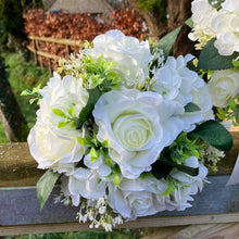 A wedding bouquet collection of artificial silk roses, hydrangea & gyp
