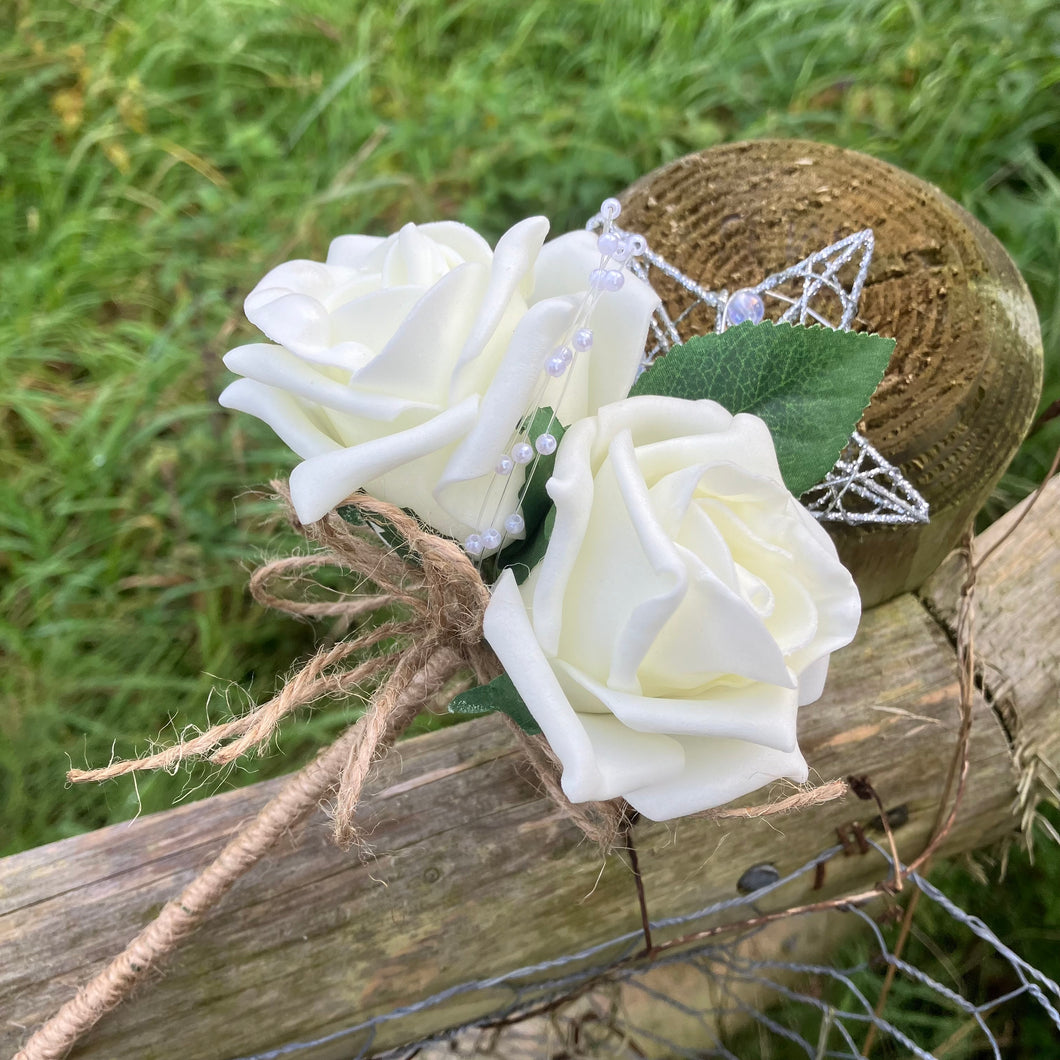 A bridesmaids star wand with ivory roses & hessian handle