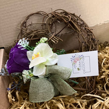 A heart wreath with flower arrangement