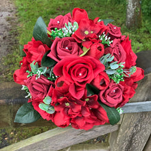 a wedding bouquet of artificial red silk roses & tulip flowers