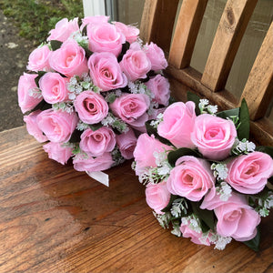 A wedding bouquet collection featuring pink roses and gyp