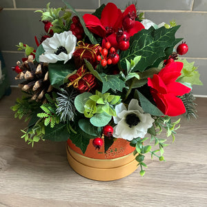 christmas flower arrangement in hat box