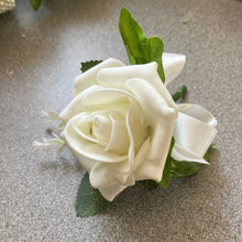 A teardrop bouquet of navy and ivory artificial roses flowers