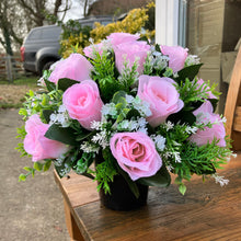 a grave pot flower arrangement featuring artificial pink rose flowers
