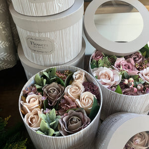 Artificial flowers in hat box - mauve and pink