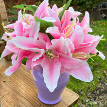 Artificial Pink lilies in acrylic vase
